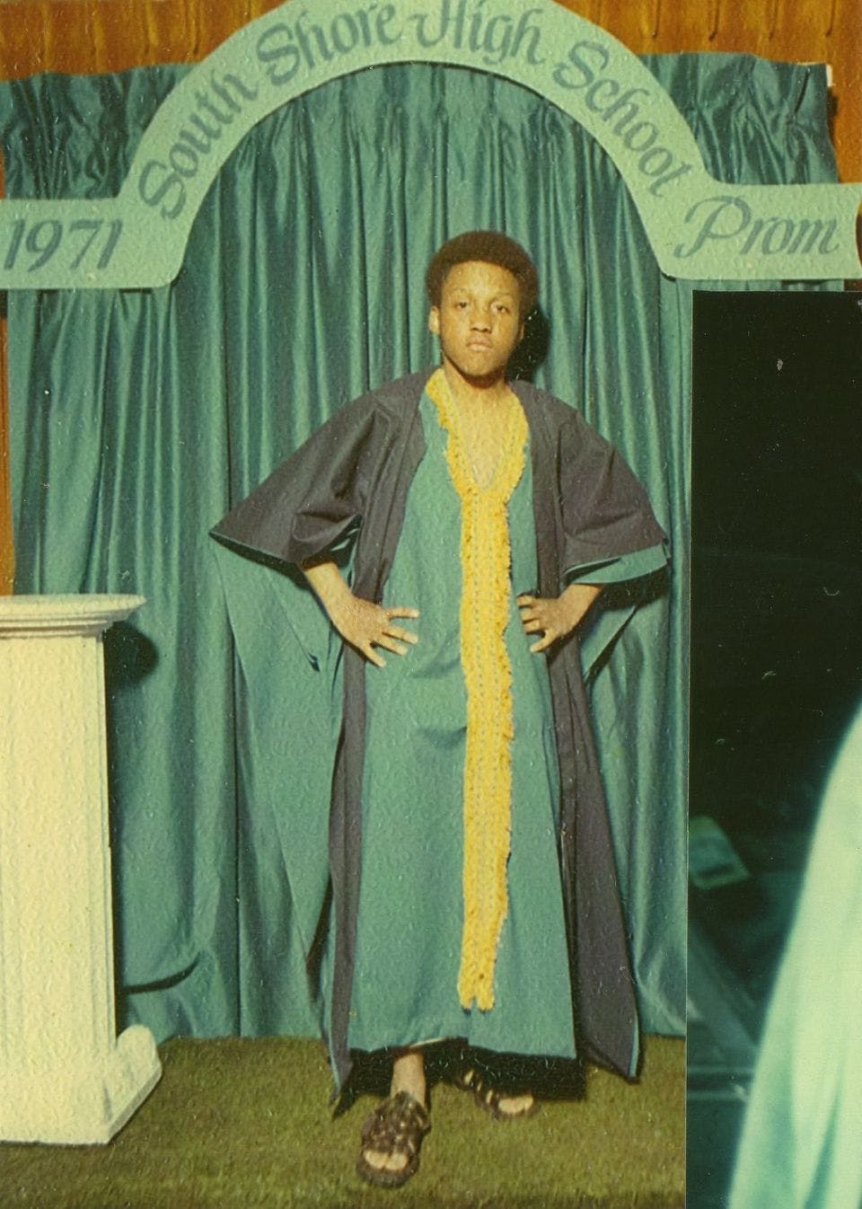 Riz Rollins wear a long tunic robe in a portrait from his 1971 prom 