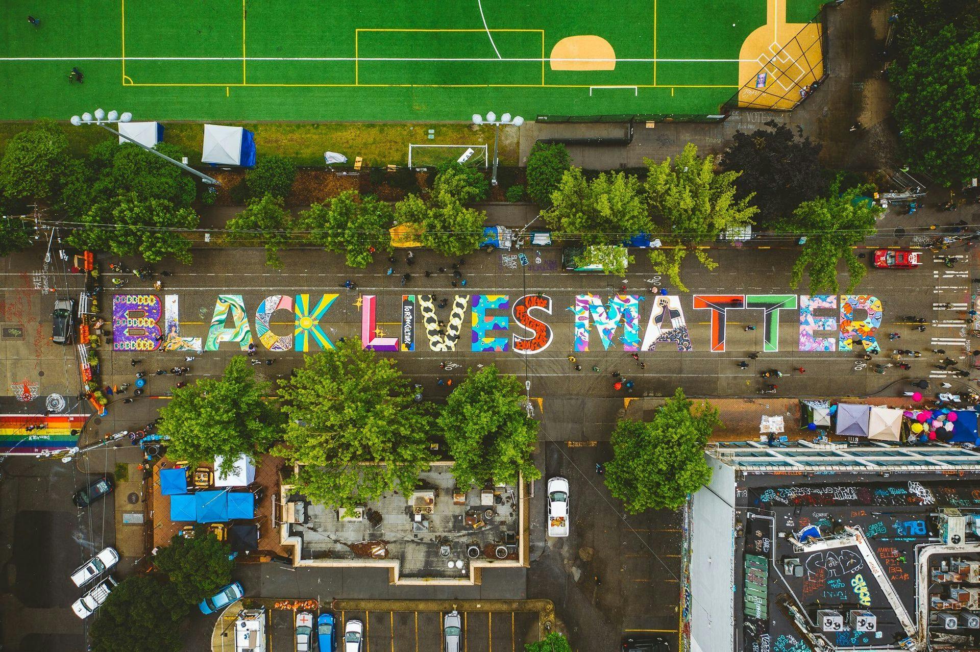 A vibrant street mural spells out Black Lives Matter
