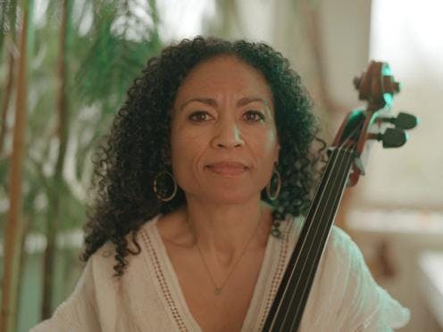 A portrait of Gretchen Yanover with her cello