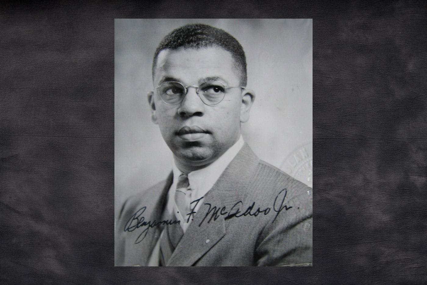 black and white portrait of a man with glasses 