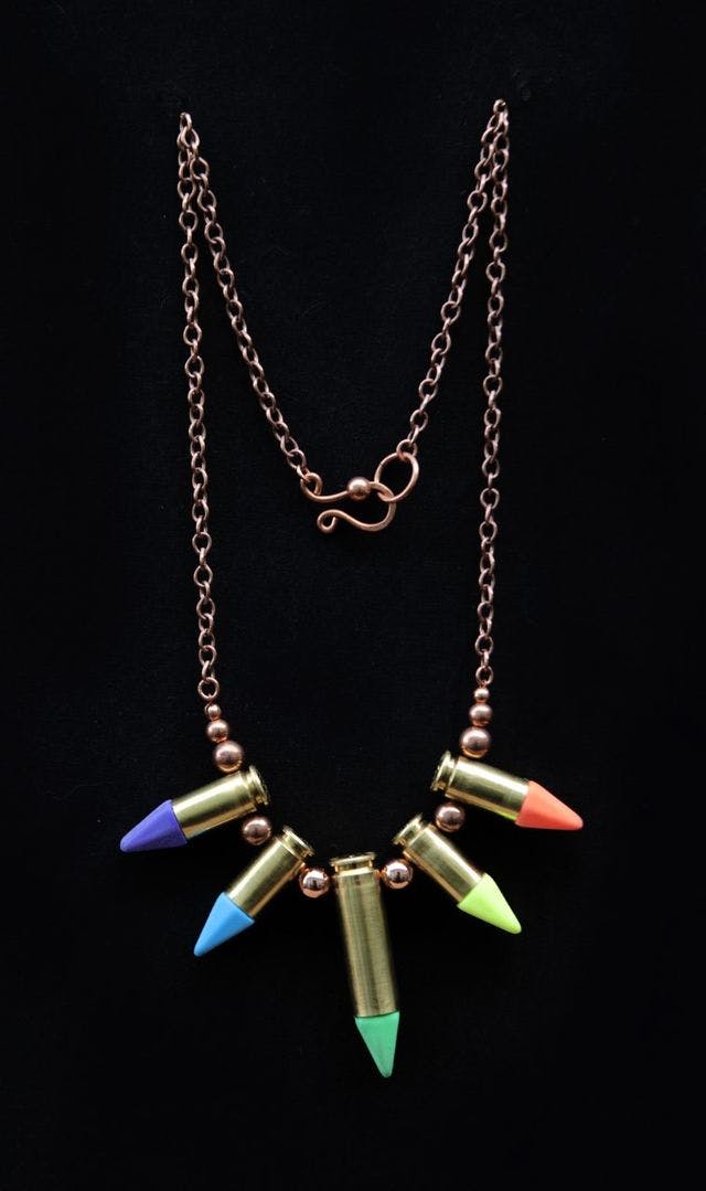 necklace made out of bullets with colorful tips