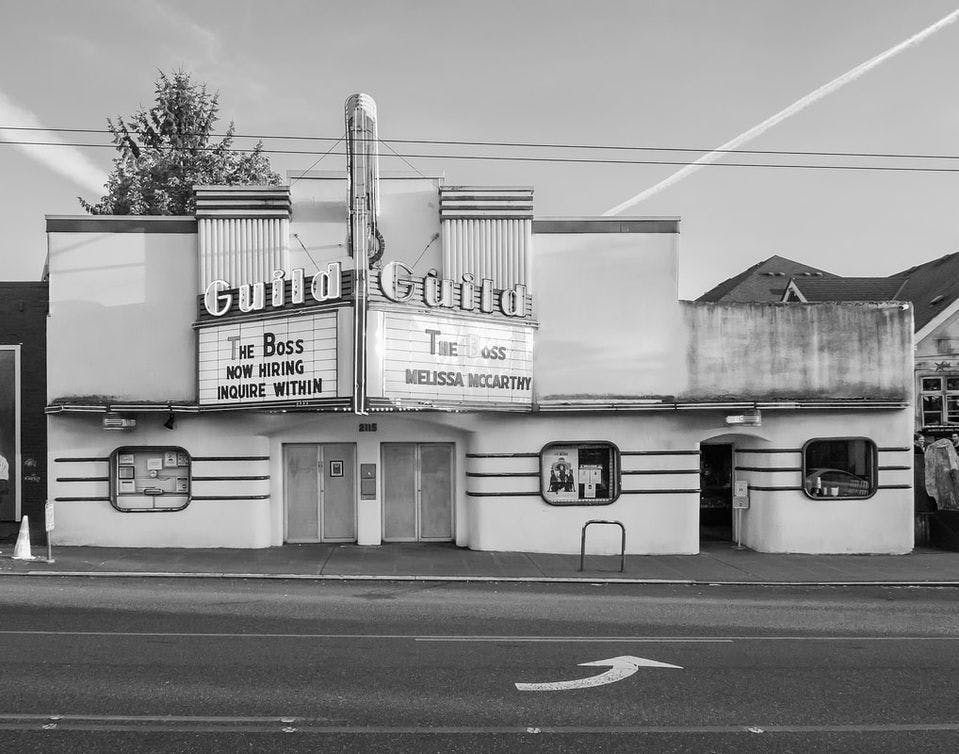 A black and white photo of a movie theater